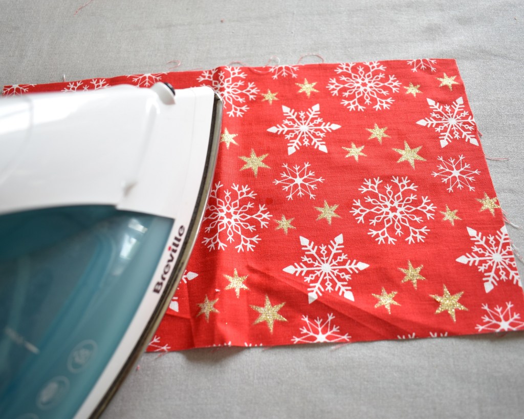 Iron fabric flat if necessary