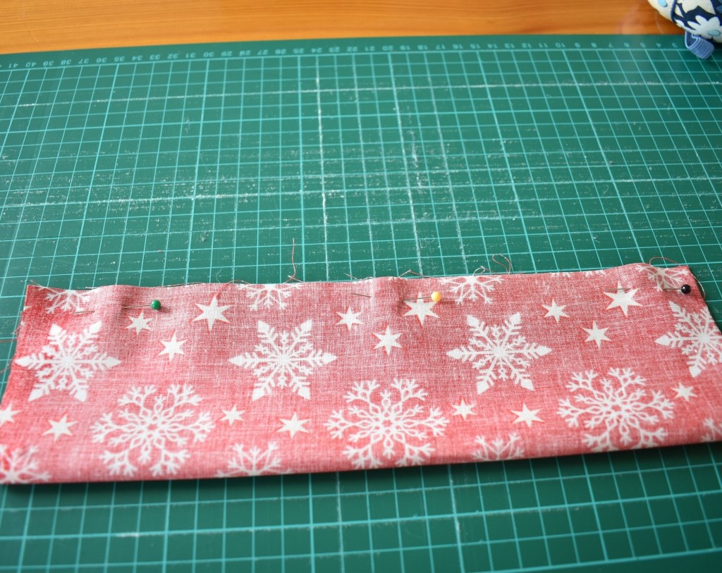 Fold in half, face side inside, pin