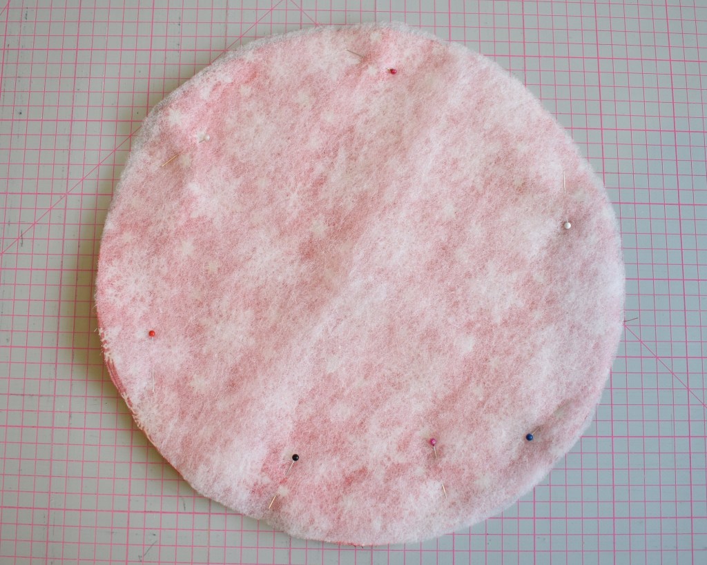 Place front and back fabric face sides together, place wadding on top