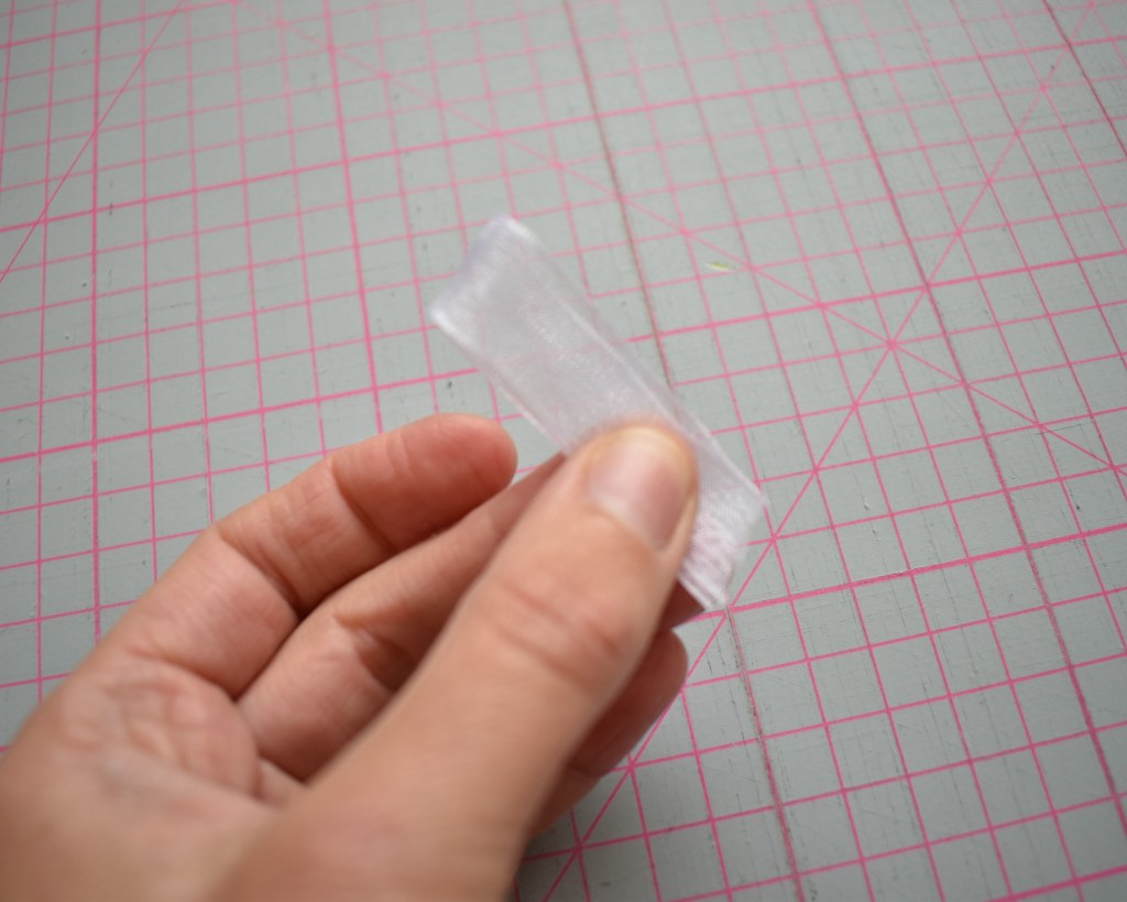 Fold the ribbon in two